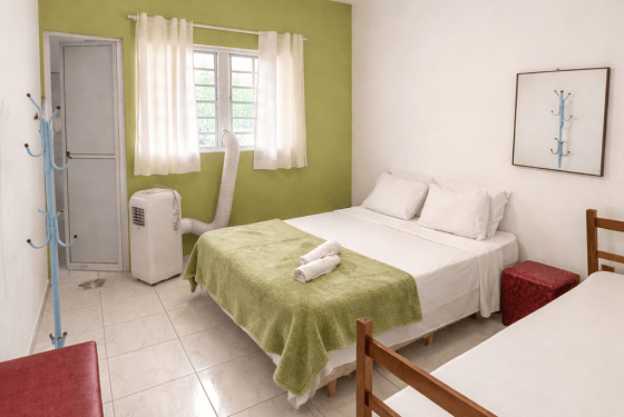 Quarto verde ar condicionado